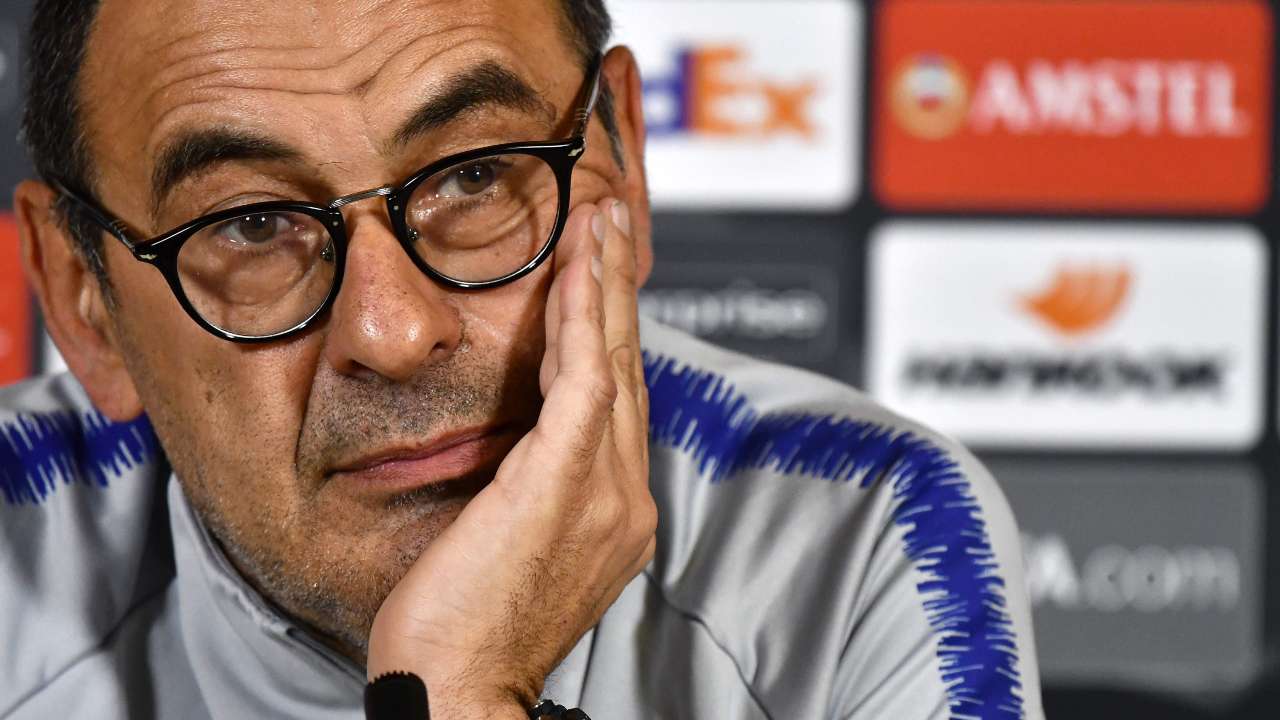 M Sarri wearing sunglasses with his hand on his face