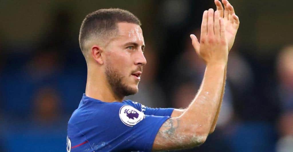 Eden Hazard wearing blue shirt while clapping his hands