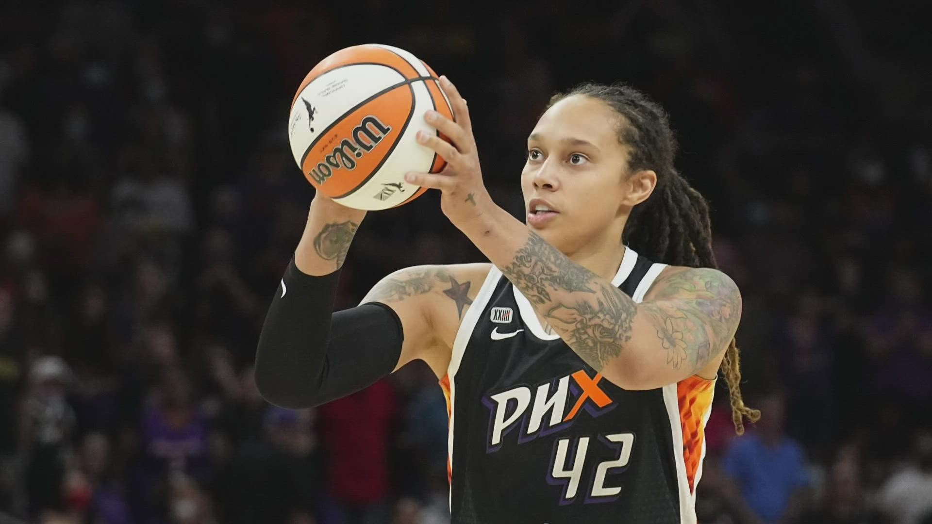Brittney Griner holding a ball and about to shoot it