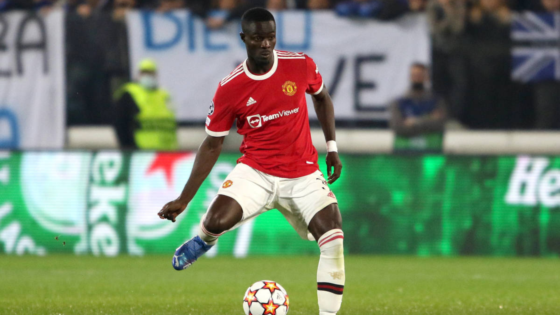 Eric Bailly playing football and about to kick the ball