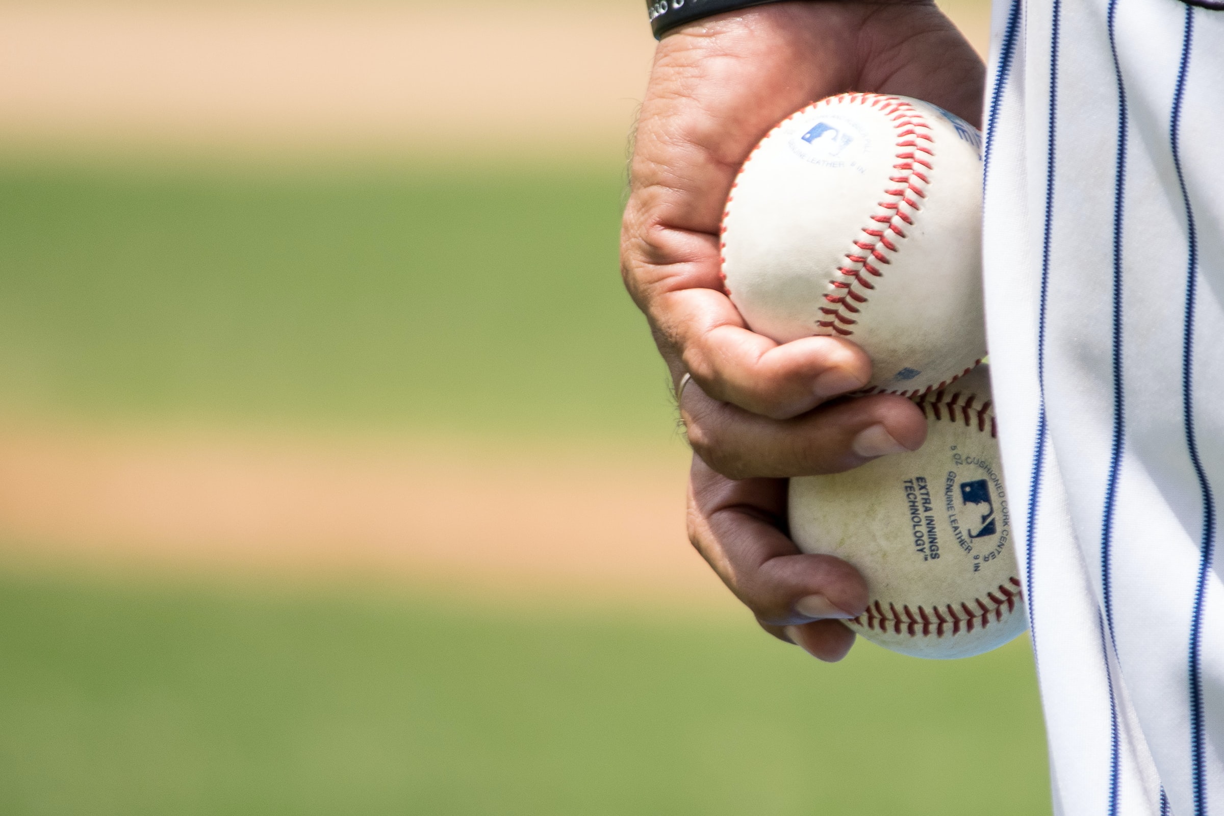 Player Holding A Baseball Ball