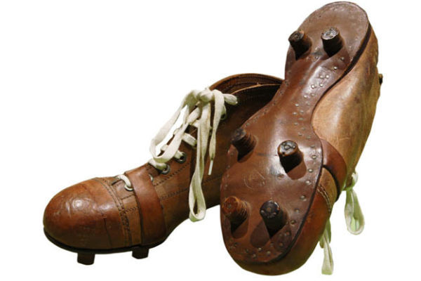 An Old Pair Of Brown Leather Soccer Cleats With 6 Studs