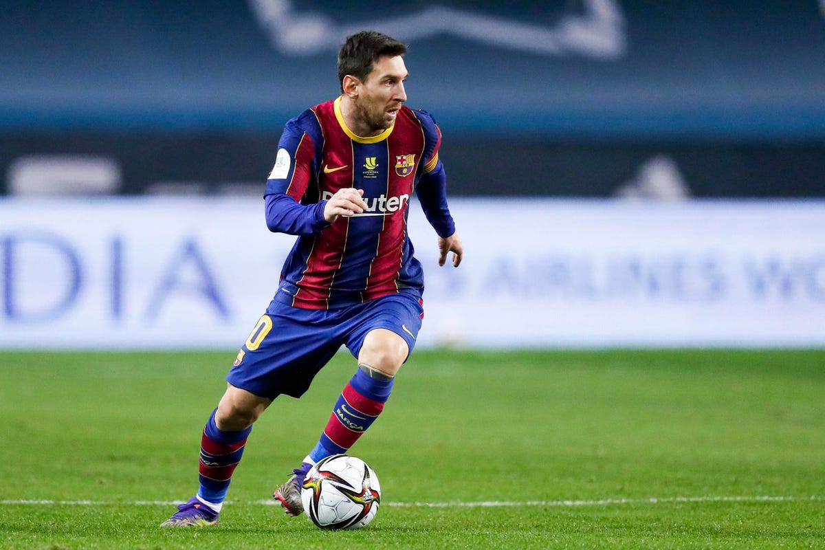 Lionel Messi Playing Soccer On A Football Ground