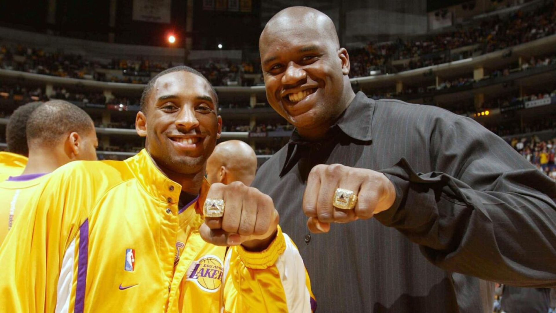 Shaquille O'Neal And Kobe Showing Their Rings