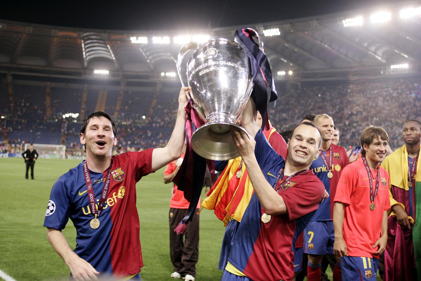Barcelona's team players holding winning trophy and enjoying