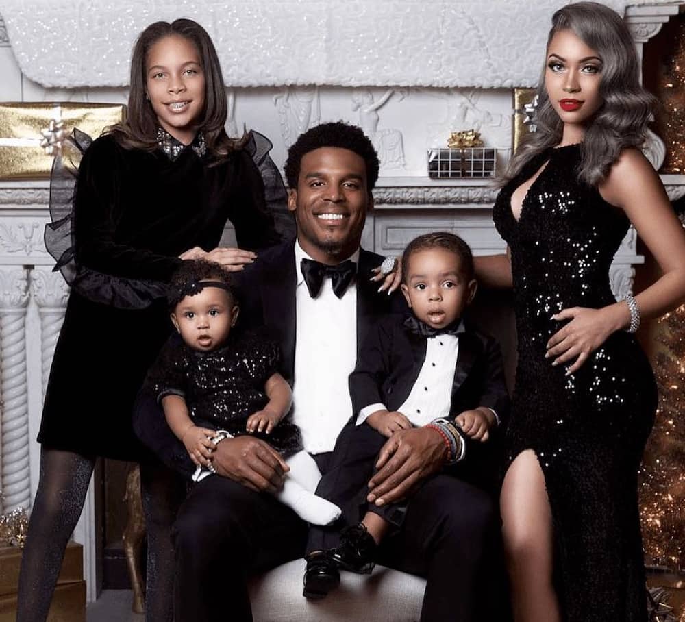 Cam Newton, ex-girlfriend, Kia Proctor, and their children In Black Dresses